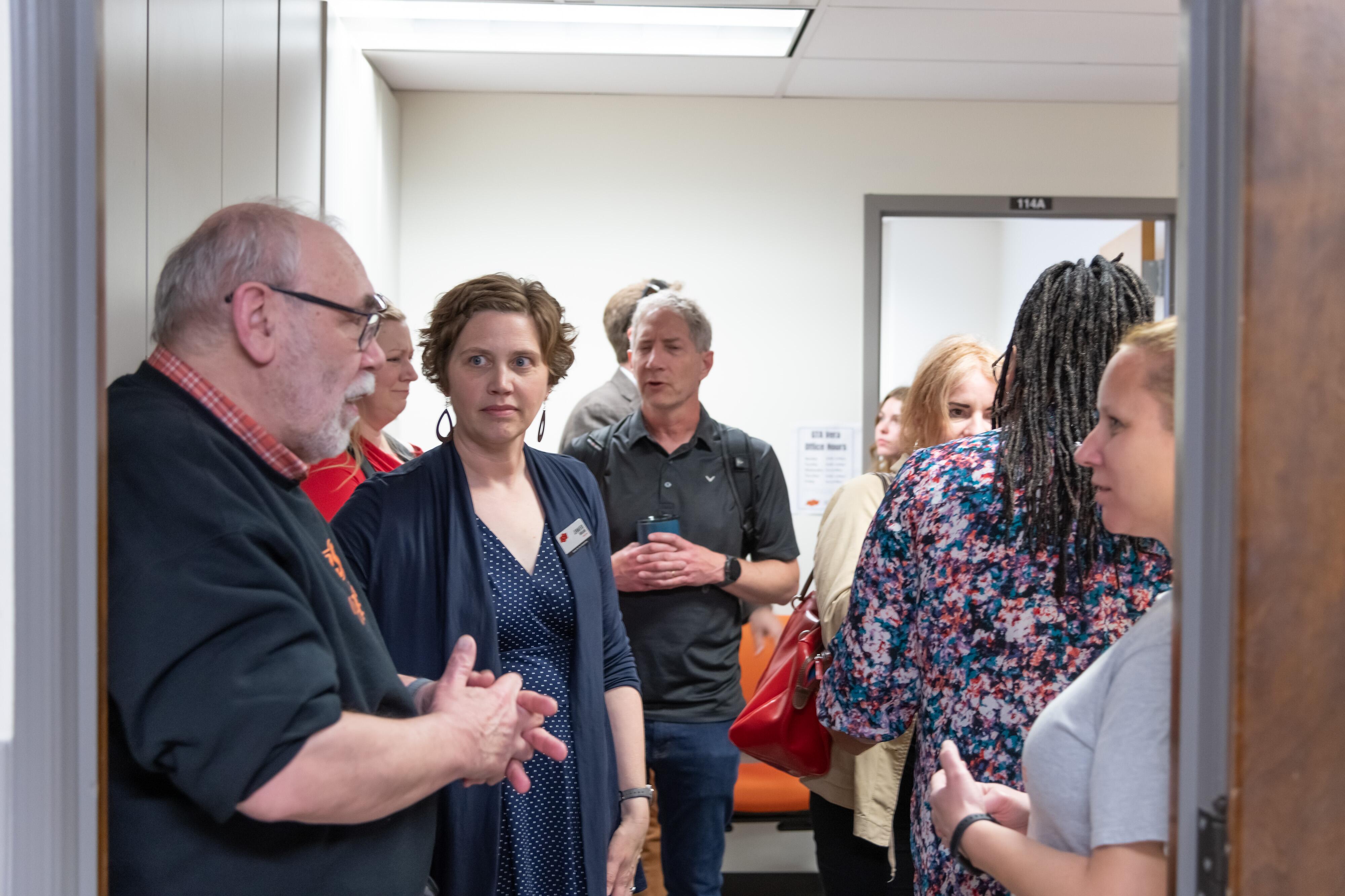 People talking in doorway