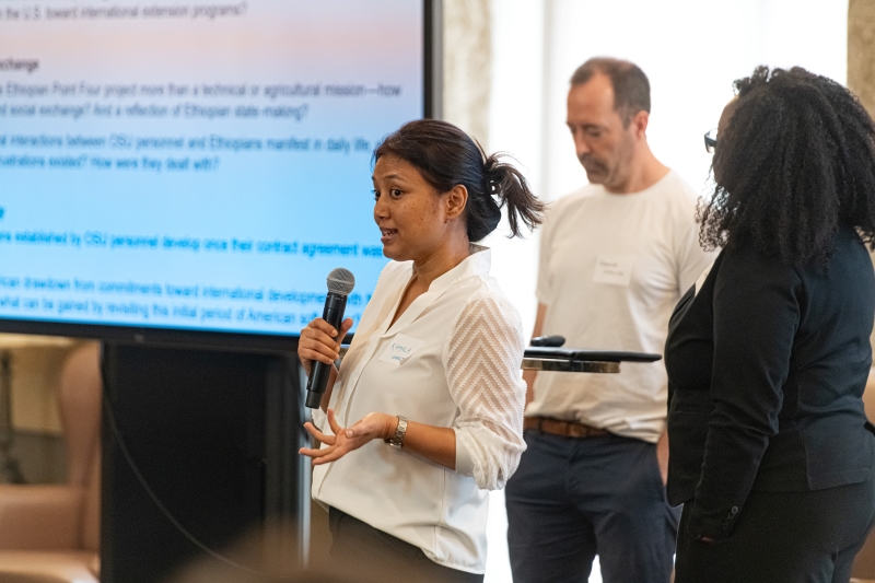 Kamala Shretha speaking into a microphone Kamala Shretha speaking into a microphone
