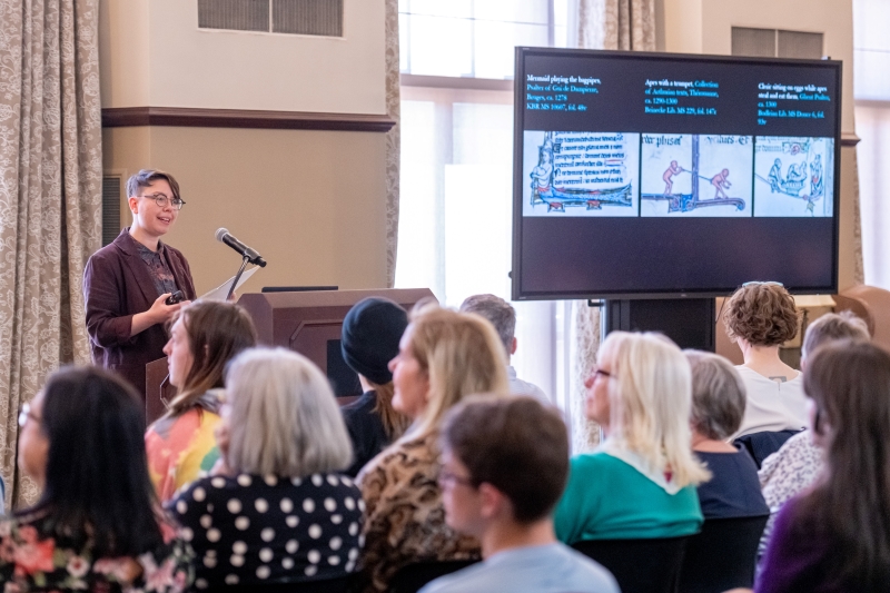 Doyle presenting in front of an audience Doyle presenting in front of an audience