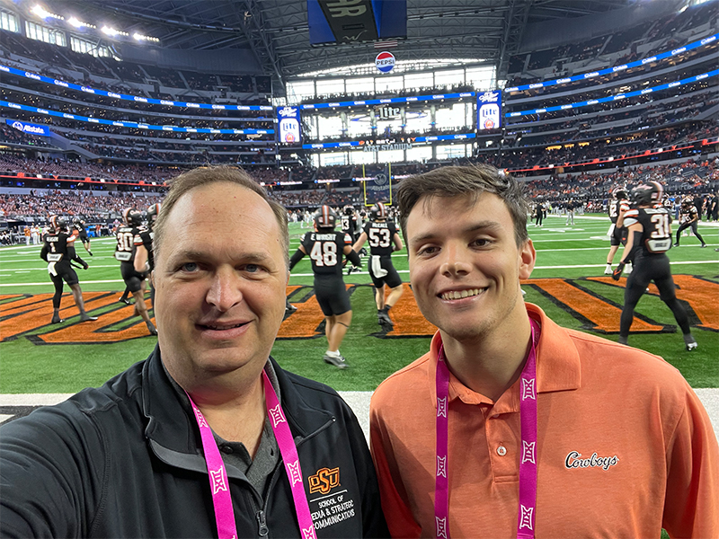 jared_football.jpg Jared posing in front of a football game