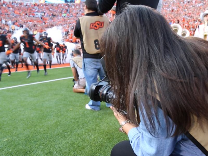 photographer shooting a football game