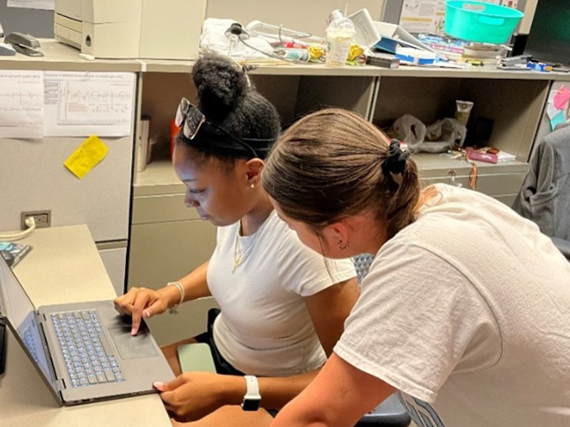 Zariah and Rosalie working on a computer