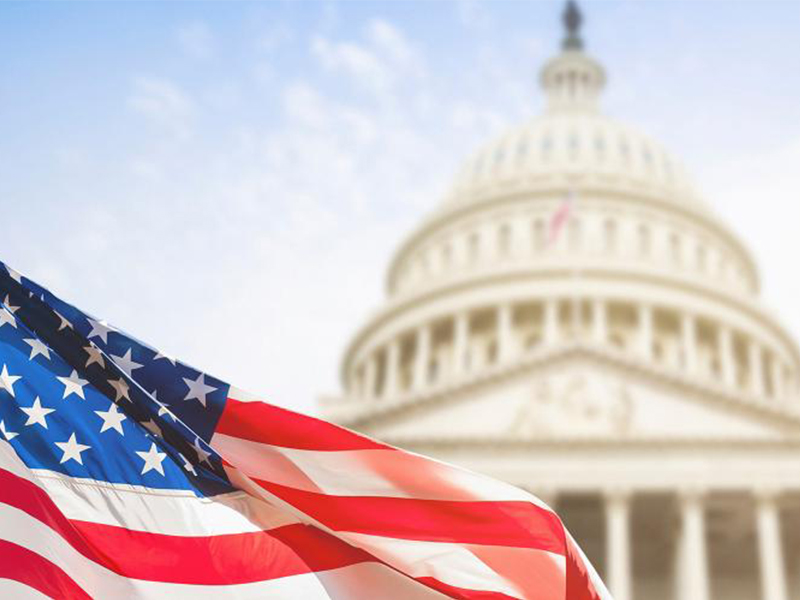 U.S. Flag flying in front of the U.S. Capitol