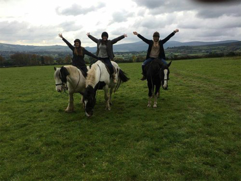 Three students horseback riding at the International Society of Paediatric Oncology Conference