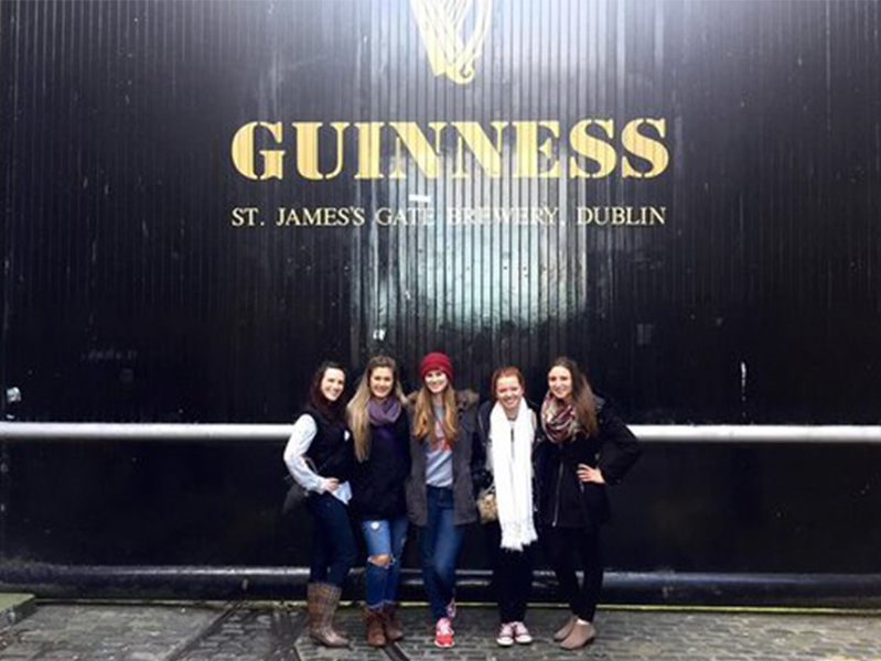 Five females standing outside the Guinness plant in Dublin, Ireland, at the International Society of Paediatric Oncology Conference