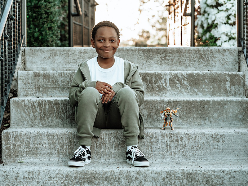 boy_onsteps.jpg African-American boy sitting outside on steps