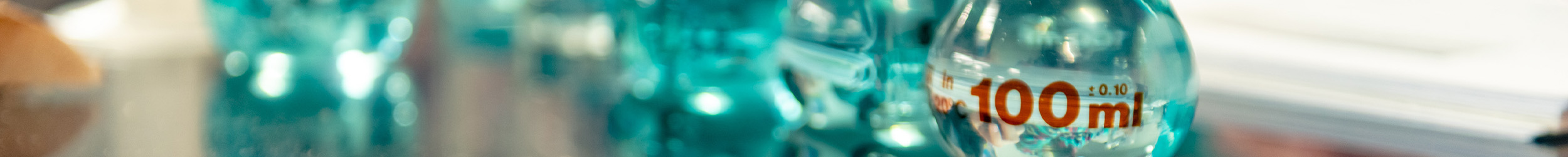 Laboratory glassware arranged on a bench.