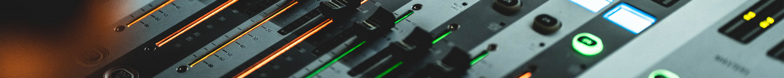 Close-up of audio controls and mixing sliders in a studio Close-up of audio controls and mixing sliders in a studio